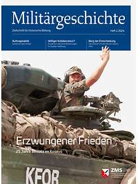 Kommandant eines Schützenpanzers der KFOR gibt mit erhobener Hand das Zeichen zur Abfahrt weiter. 